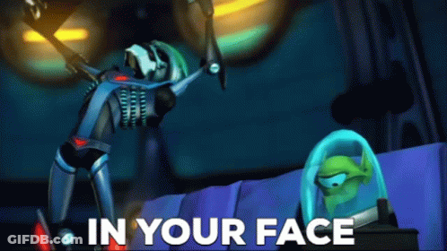 A Cartoon Character With The Words " In Your Face " On The Bottom Right GIF