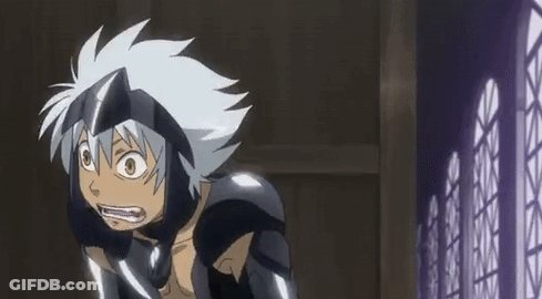 A Cartoon Character With White Hair And A Helmet Is Standing In Front Of A Fence . GIF