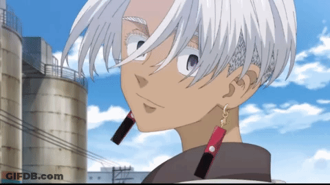 A Cartoon Character With White Hair And Red Earrings Stands In Front Of A Silo GIF