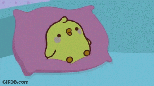 A Cartoon Chicken Is Sleeping In A Bed With A Blanket On It . GIF