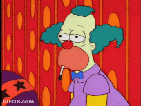 A Cartoon Clown Smoking A Cigarette In Front Of A Red Curtain GIF