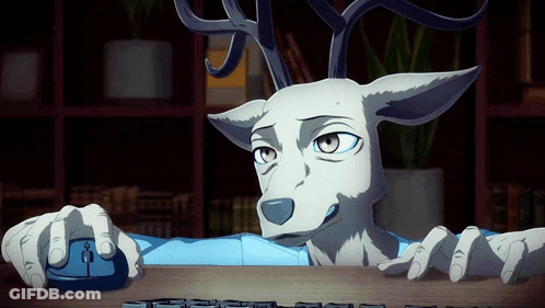 A Cartoon Deer Is Using A Computer Mouse And Keyboard GIF