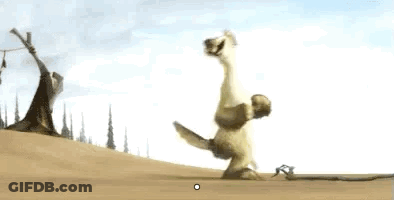 A Cartoon Dinosaur Is Standing On Its Hind Legs On Top Of A Sandy Hill . GIF