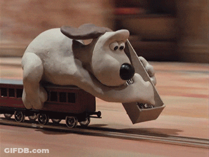 A Cartoon Dog Is Carrying A Box On A Train Track GIF
