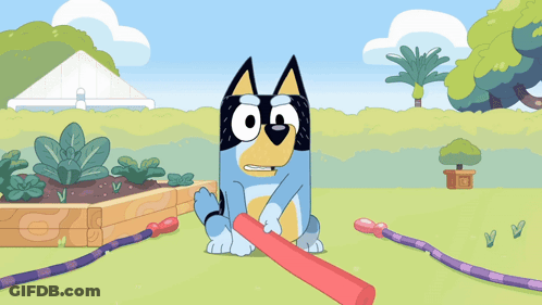 A Cartoon Dog Is Holding A Red Stick GIF