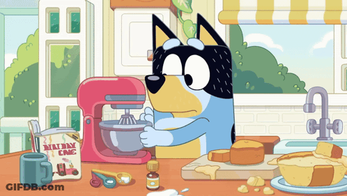 A Cartoon Dog Is Mixing Something In A Mixer With A Box Of Millway Cake Mix GIF
