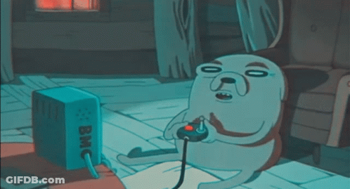 A Cartoon Dog Is Playing A Video Game With A Box That Says Bmc On It GIF