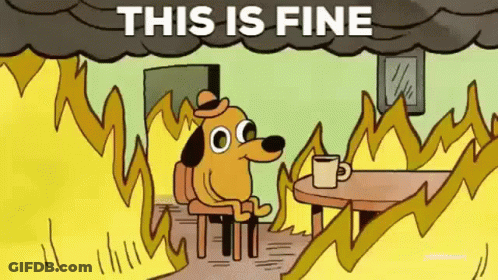 A Cartoon Dog Is Sitting At A Table With A Cup Of Coffee In Front Of A Fire With The Words This Is Fine Above Him . GIF