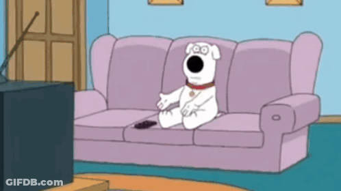 Cartoon Dog Sitting On Couch With Remote GIF