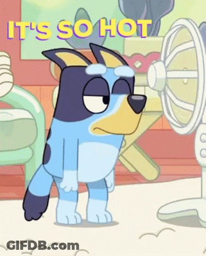 A Cartoon Dog Is Standing In Front Of A Fan With The Words `` It 'S So Hot '' Written On It . GIF