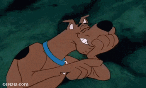 A Cartoon Dog With A Blue Collar Is Pointing At Something GIF