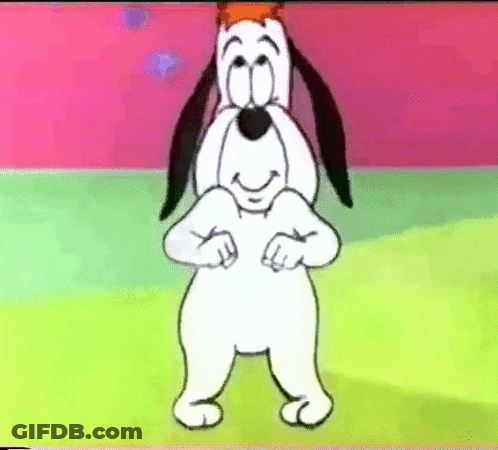 A Cartoon Dog With A Crown On His Head Is Standing On A Green Field And Smiling . GIF