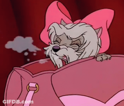 A Cartoon Dog With A Pink Bow On Its Head Is Sitting In A Pink Purse . GIF