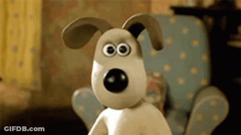 A Cartoon Dog With Big Eyes Is Sitting In A Chair GIF