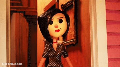 A Cartoon Doll Is Standing In A Doorway With A Picture On The Wall . GIF