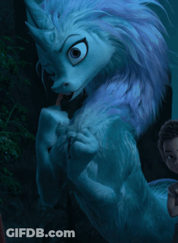 A Cartoon Drawing Of A Blue And White Monster With A Purple Mane GIF