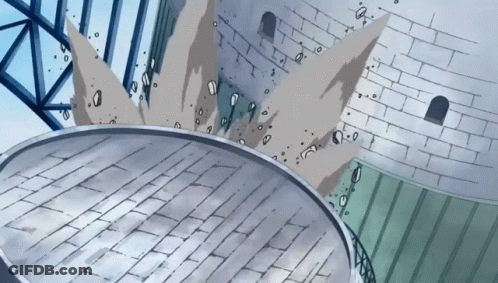 A Cartoon Drawing Of A Brick Wall With A Circular Object In The Foreground GIF