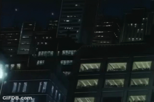 A Cartoon Drawing Of A City At Night With A Yellow Light In The Middle . GIF