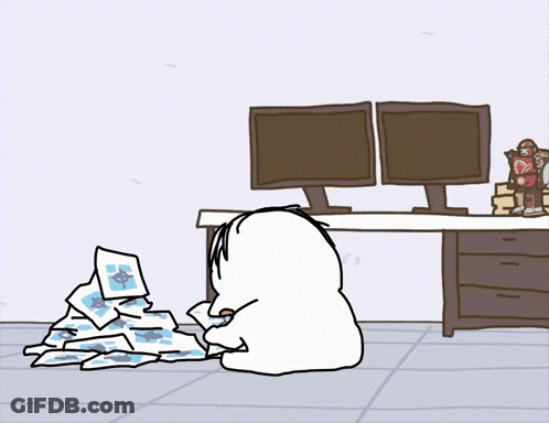 A Cartoon Drawing Of A Person Sitting At A Desk GIF
