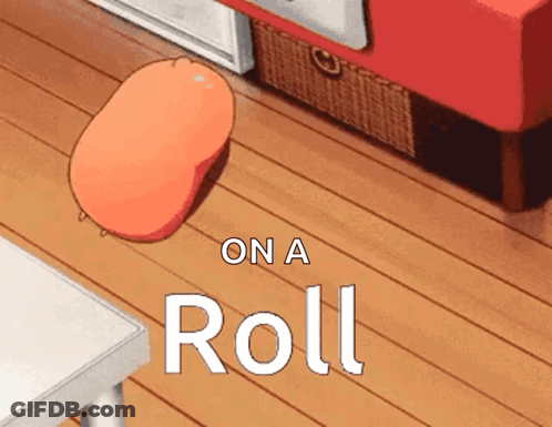 A Cartoon Drawing Of A Roll Sitting On A Table GIF