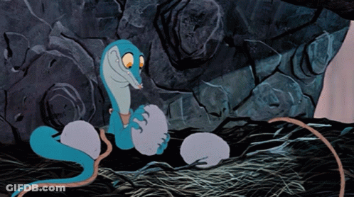 A Cartoon Drawing Of A Snake Laying Eggs GIF