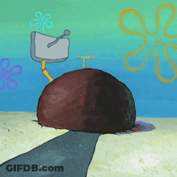 A Cartoon Drawing Of A Spongebob Squarepants Scene With A Large Rock In The Sand GIF