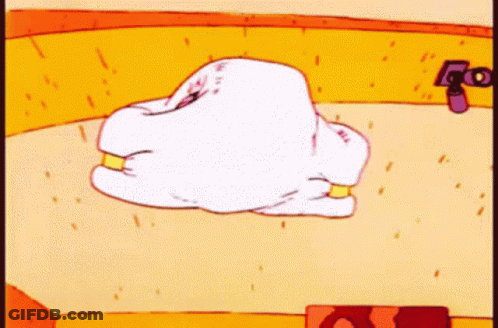 A Cartoon Drawing Of A White Pillow With Gold Rings GIF
