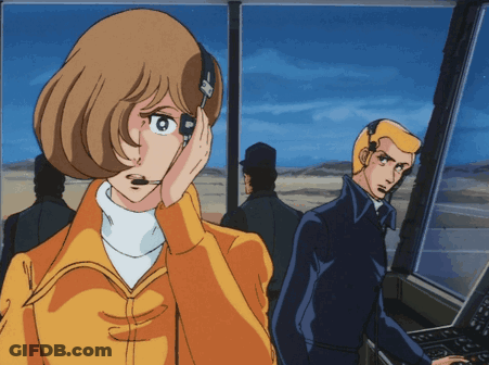 A Cartoon Drawing Of A Woman Wearing A Headset And A Man Sitting At A Control Panel GIF