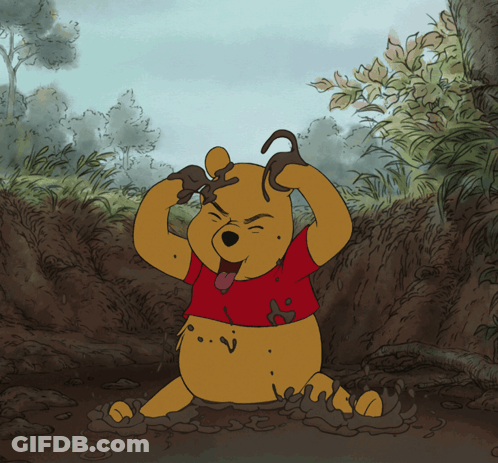 A Cartoon Drawing Of Winnie The Pooh Playing In The Dirt GIF