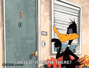 A Cartoon Duck Is Standing In Front Of A Door Talking To Anyone . GIF