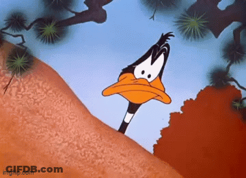 A Cartoon Duck Is Standing On Top Of A Hill Looking At The Camera . GIF