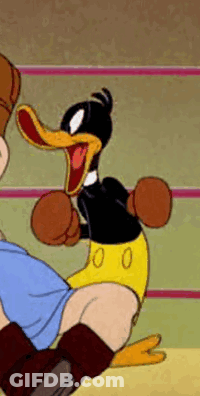 A Cartoon Duck Is Wearing Boxing Gloves And Kicking A Person . GIF