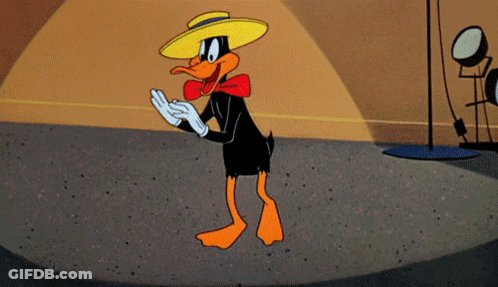 A Cartoon Duck Wearing A Yellow Hat And Gloves GIF