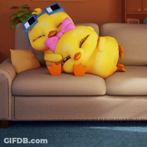 A Cartoon Duck Wearing Sunglasses And A Pink Bow Tie Is Laying On A Couch GIF