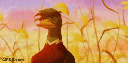 A Cartoon Duck With A Red Shirt On Is Standing In A Field GIF
