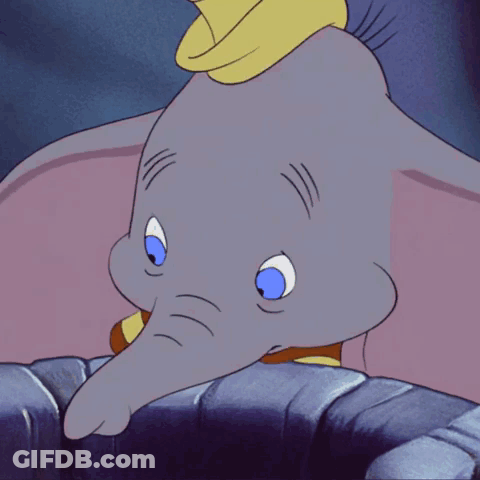 A Cartoon Elephant With Blue Eyes And A Red And Yellow Striped Shirt GIF