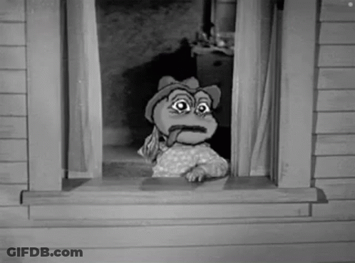 A Cartoon Frog Is Sticking Its Tongue Out Of A Window . GIF