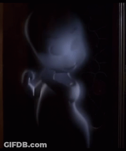 A Cartoon Ghost Is Standing In A Dark Room And Looking At The Camera GIF