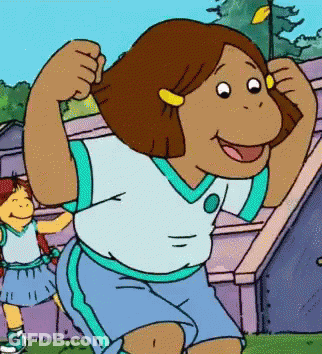A Cartoon Girl Is Flexing Her Muscles In Front Of A Purple Building GIF