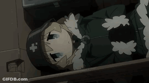 A Cartoon Girl Is Laying On The Floor In A Dark Room . She Is Wearing A Black Hat With A Cross On It . GIF