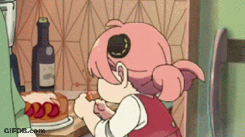 A Cartoon Girl Is Sitting At A Table Eating A Cake . GIF