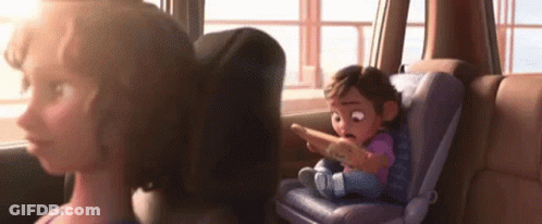 A Cartoon Girl Is Sitting In A Car Seat Looking At A Cell Phone . GIF