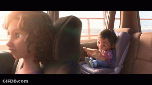 A Cartoon Girl Is Sitting In A Car Seat Looking Out The Window GIF
