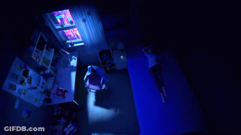 A Cartoon Girl With A Heart On Her Chest Is Laying In Bed GIF