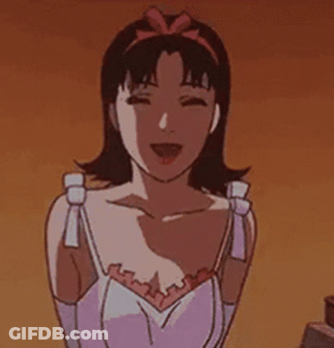 A Cartoon Girl With A Surprised Look On Her Face Is Standing Next To A Bed And Looking At The Camera . GIF