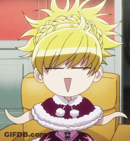 A Cartoon Girl With Blonde Hair Is Sitting In A Chair GIF