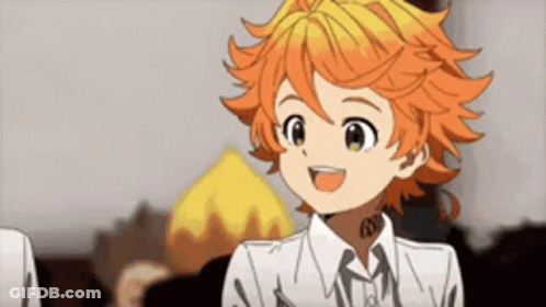 A Cartoon Girl With Orange Hair Is Smiling And Wearing A White Shirt . GIF
