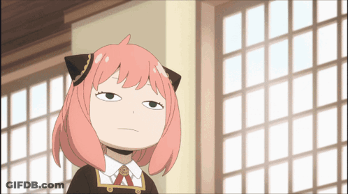 A Cartoon Girl With Pink Hair And Black Ears Is Making A Funny Face GIF