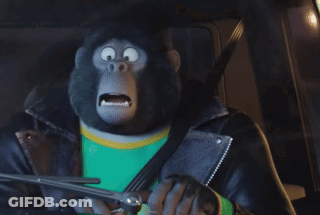 A Cartoon Gorilla Wearing A Leather Jacket And A Green Shirt Is Driving A Car GIF