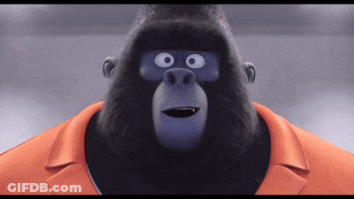 A Cartoon Gorilla Wearing An Orange Collared Shirt GIF